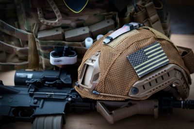 Military,Equipment,With,A,Rifle,On,A,Wooden,Table
